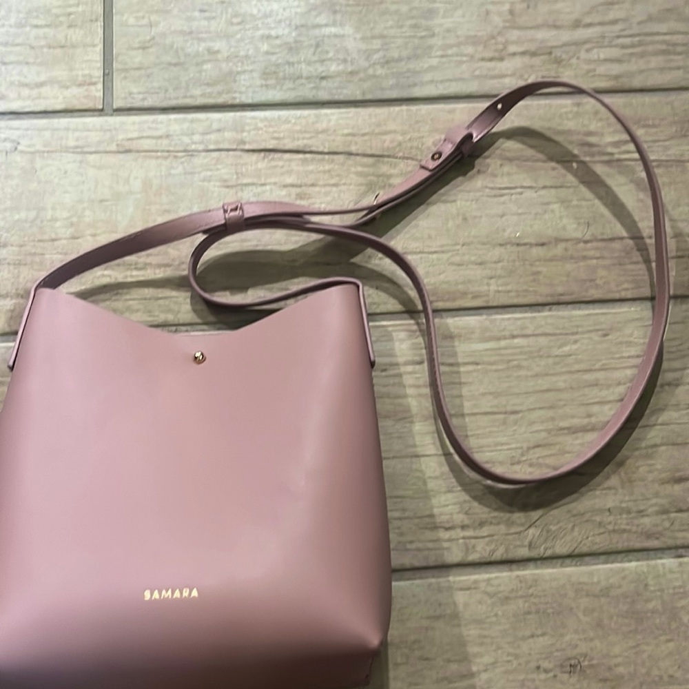 It’s a dusty pink Samara over the shoulder bag.